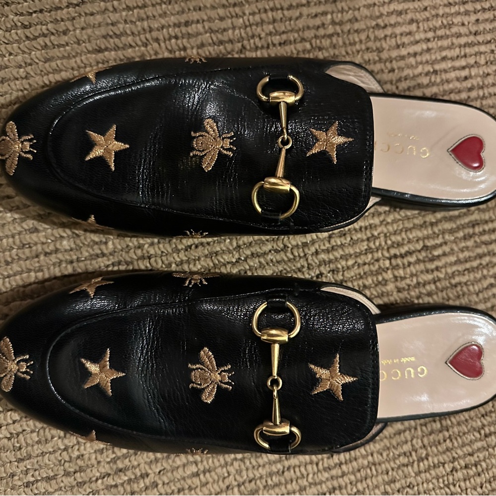 Gucci Black Leather Mules with Gold Embellishments